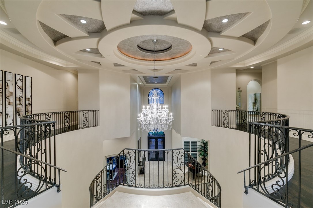 4 Awbrey Court Henderson, NV 89052 - Photo 52 of 72 Stairs with a high ceiling, recessed lighting, a chandelier, coffered ceiling, and beam ceiling