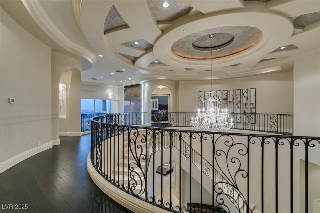 4 Awbrey Court Henderson, NV 89052 - Photo 53 of 72 Corridor featuring wainscoting, wood finished floors, a chandelier, recessed lighting, and crown molding