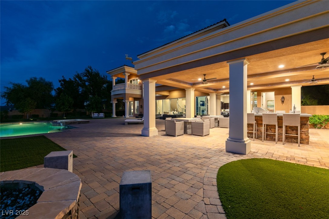4 Awbrey Court Henderson, NV 89052 - Photo 59 of 72 Patio / terrace featuring an outdoor bar, a ceiling fan, an outdoor pool, and a patio area