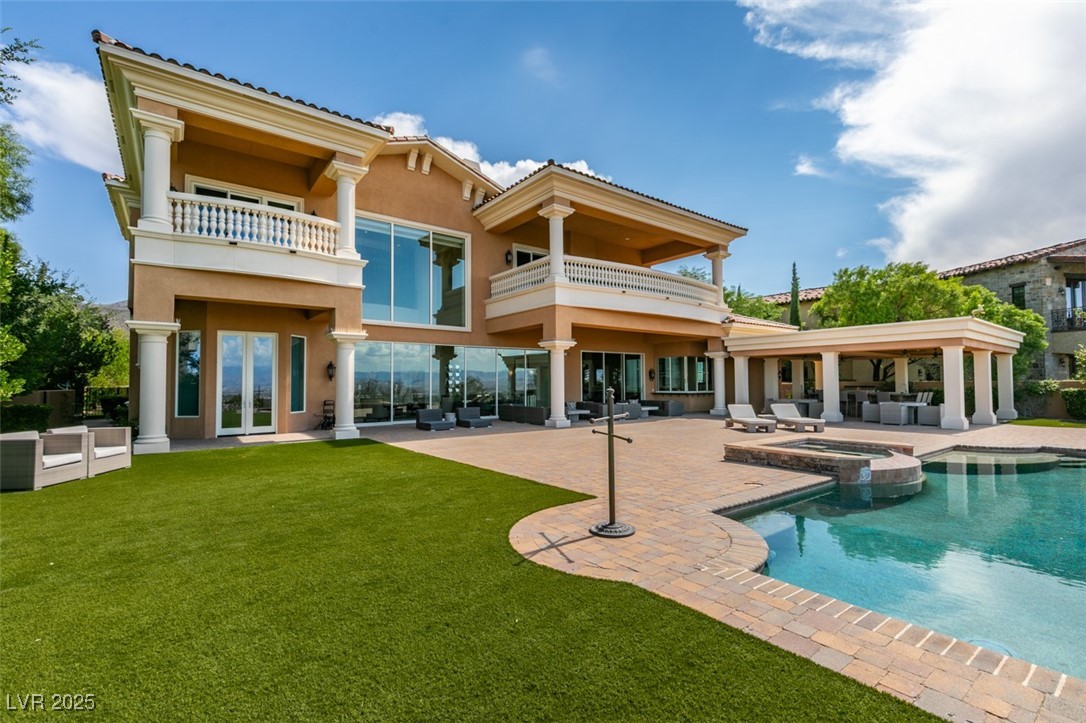 4 Awbrey Court Henderson, NV 89052 - Photo 62 of 72 Back of property with outdoor lounge area, a balcony, a patio, and stucco siding
