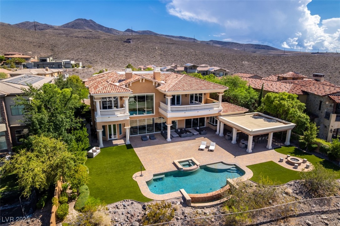 4 Awbrey Court Henderson, NV 89052 - Photo 63 of 72 Aerial view of property and surrounding area with a pool area and mountains
