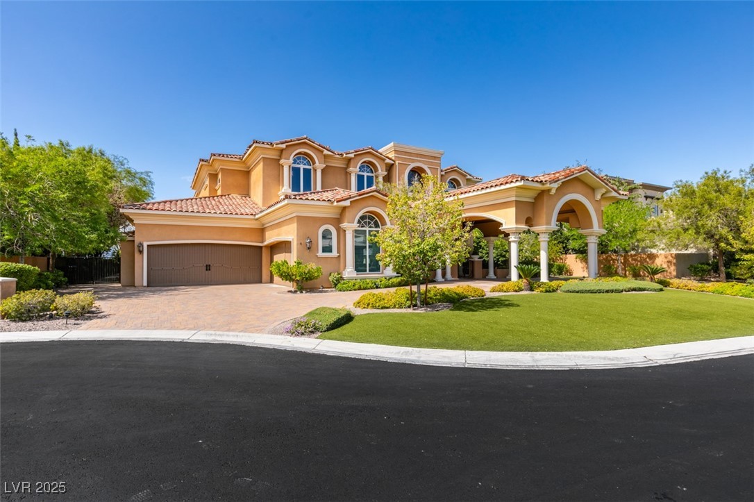 4 Awbrey Court Henderson, NV 89052 - Photo 65 of 72 Mediterranean / spanish home featuring stucco siding, a garage, driveway, and a tiled roof