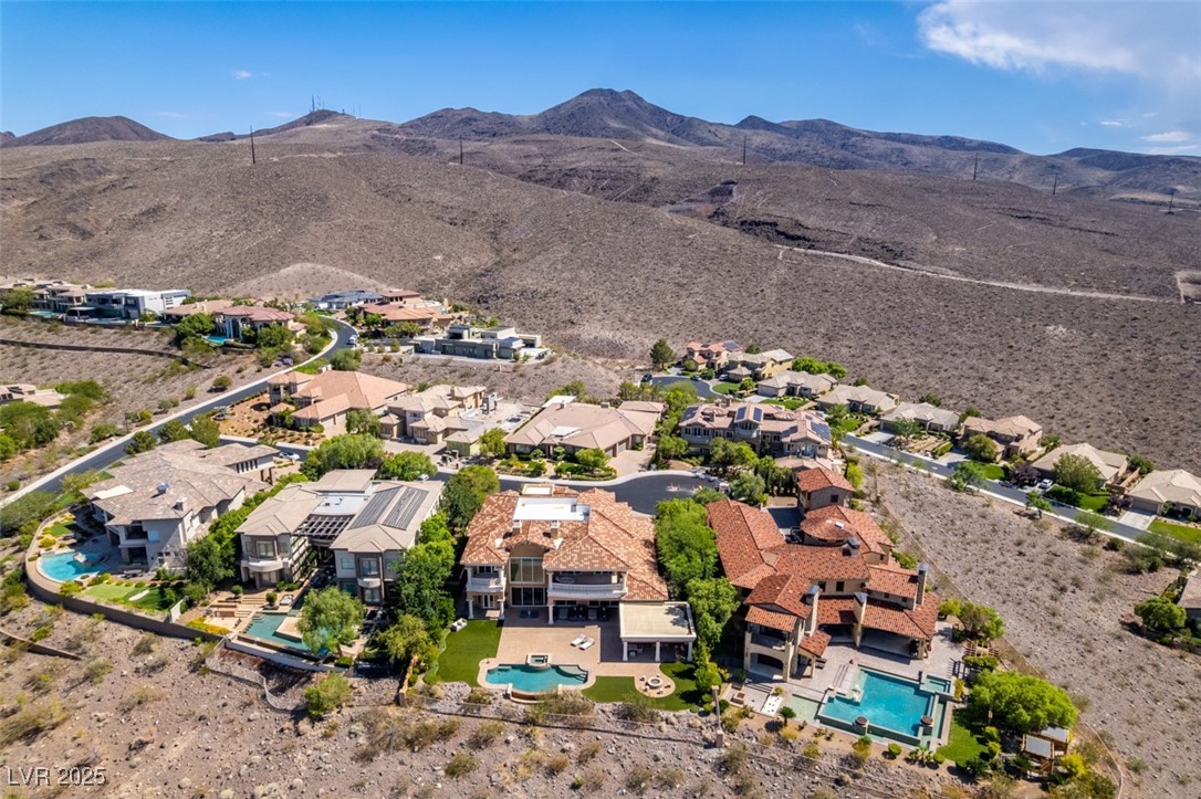 4 Awbrey Court Henderson, NV 89052 - Photo 71 of 72 Aerial view of residential area with a mountain backdrop and a pool