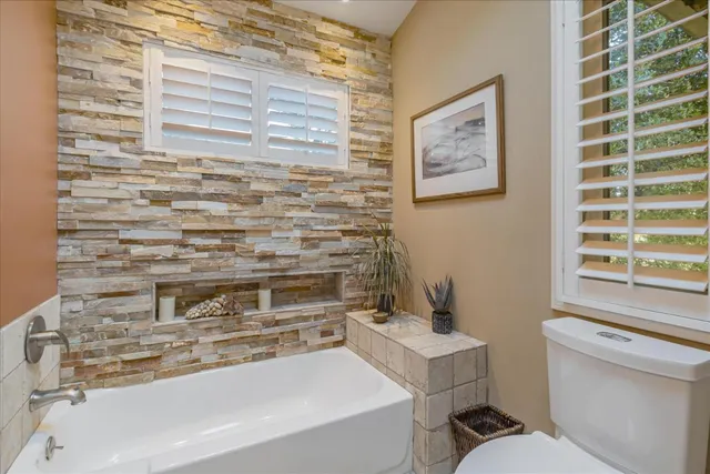 a living room with a stove and a window