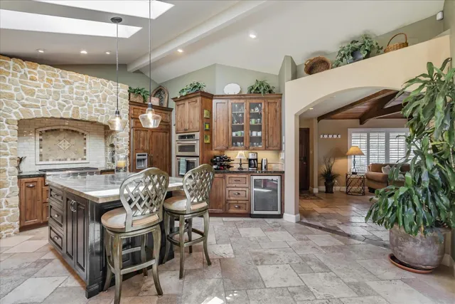 a view of a patio with dining table and chairs