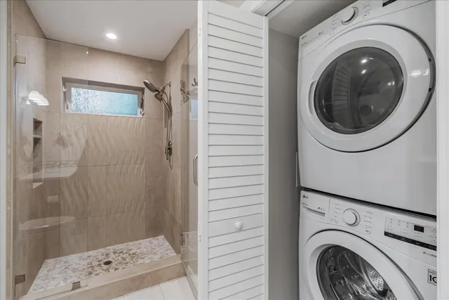 a view of a hallway with washer and dryer