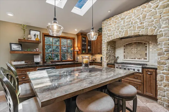 a kitchen with counter space and breakfast area