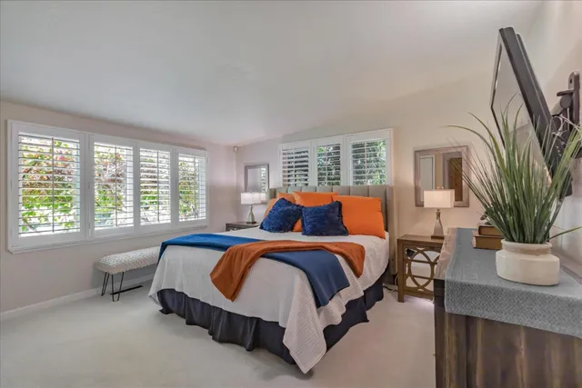 a bedroom with bed and window