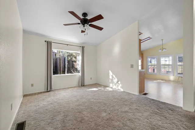 a kitchen with granite countertop stainless steel appliances and refrigerator