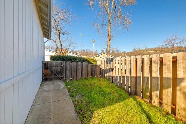 a front view of a house with yard and garage
