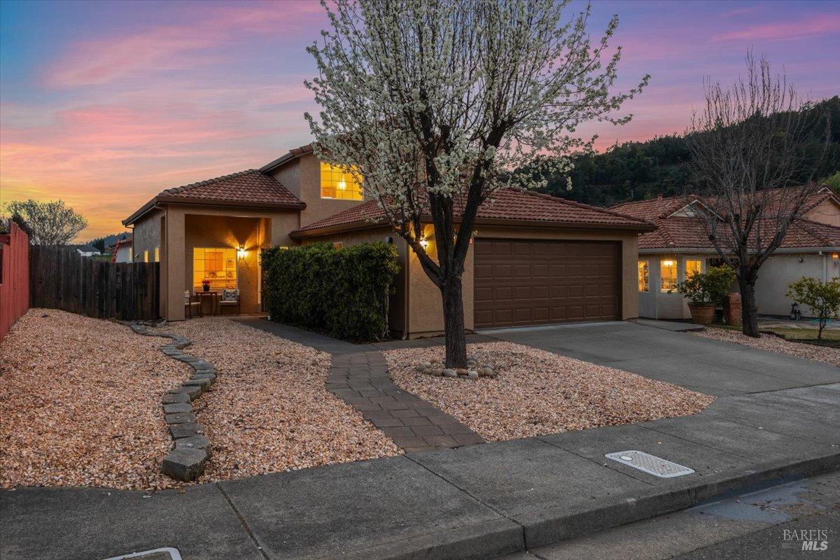 315 Toscana Circle Cloverdale, CA 95425 - Photo 1 of 1 a front view of a house with a yard and garage