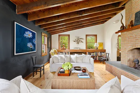 a living room with furniture and a table