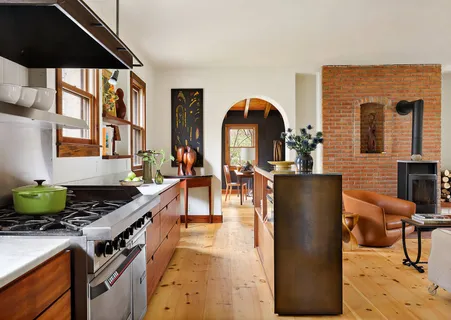 a kitchen with stainless steel appliances granite countertop a stove and a refrigerator