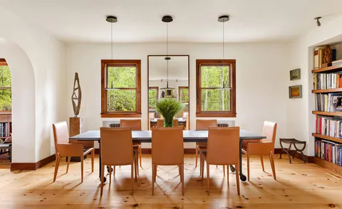 a table with chairs and a stove