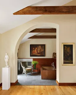 a room with furniture and painting on the wall