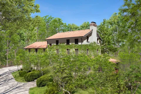 a view of a garden with an outdoor seating