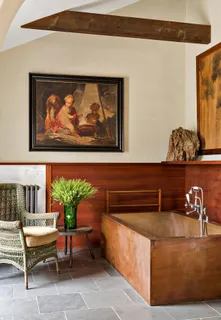 a view of a patio with couple of chairs