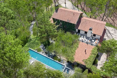 front view of a house with a tree