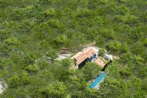 a view of a field with an outdoor space and seating area