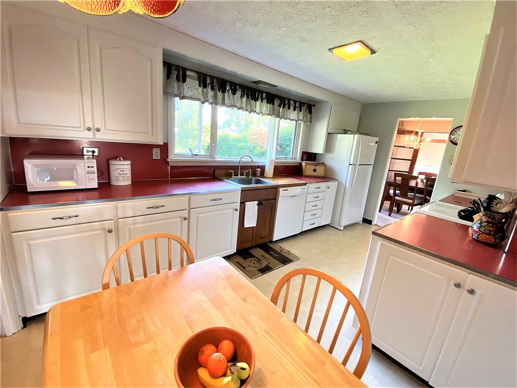 1560 Westfall Road Brighton, NY 14618 - Photo 16 of 40 An eat-in kitchen with a huge amount of storage sp