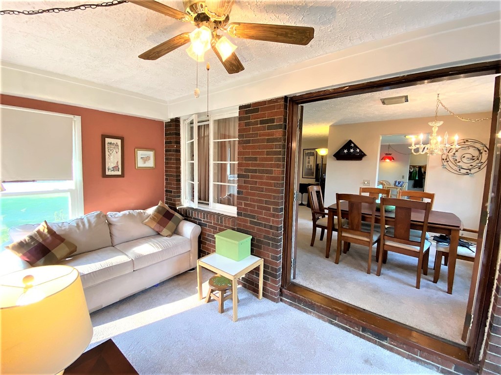 1560 Westfall Road Brighton, NY 14618 - Photo 19 of 40 The sunroom is a stunning addition where you'll wa