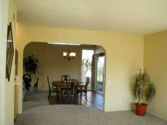 4807 Rue Nice Court San Jose, CA 95136 - Photo 11 of 16 a view of a dining room with furniture and a potted plant