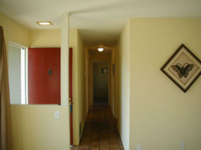 4807 Rue Nice Court San Jose, CA 95136 - Photo 15 of 16 a view of a hallway with wooden floor