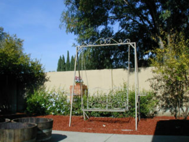 4807 Rue Nice Court San Jose, CA 95136 - Photo 7 of 16 a view of a street with a bench in front of it