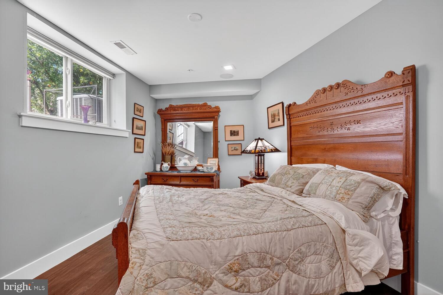 5700 Blair Road Northeast Washington, DC 20011 - Photo 37 of 45 a bedroom with a bed and wooden floor