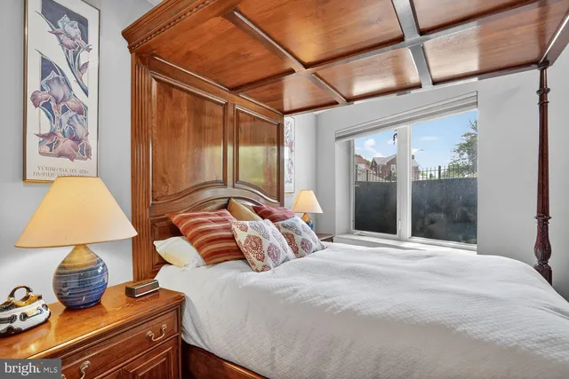 a bedroom with a bed and a closet