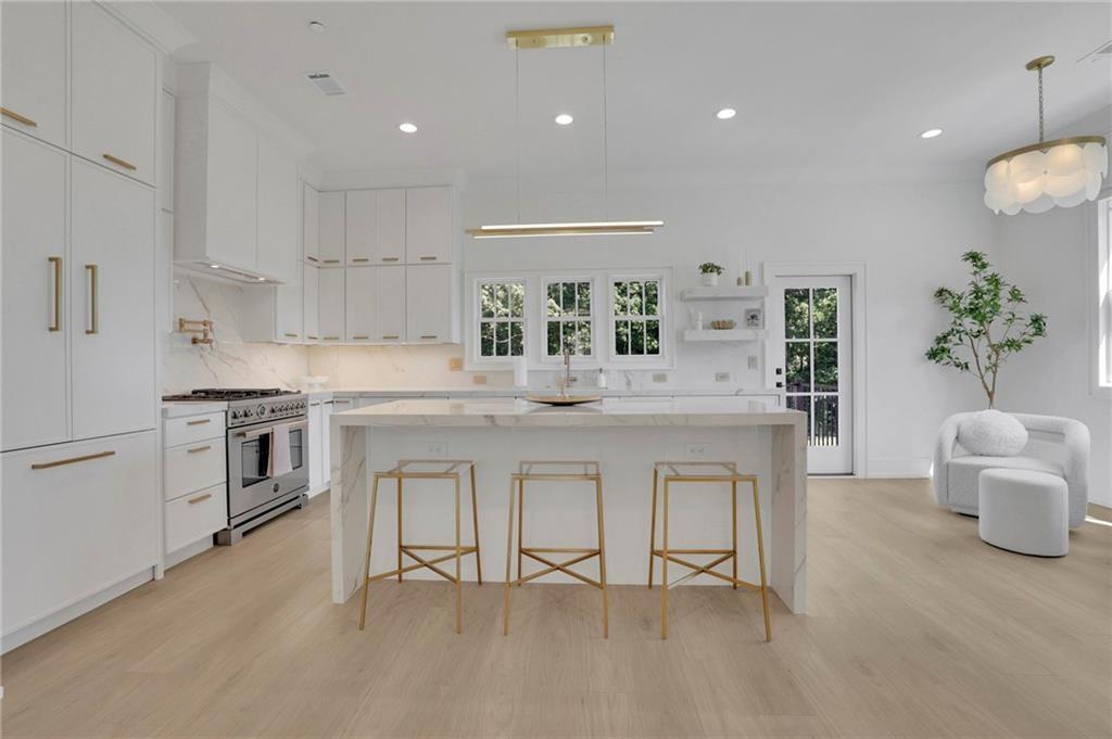 343 Sugarview Road Sugar Hill, GA 30518 - Photo 12 of 40 a kitchen with white cabinets and counter space