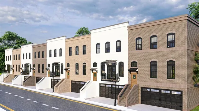 a view of a white building among the street