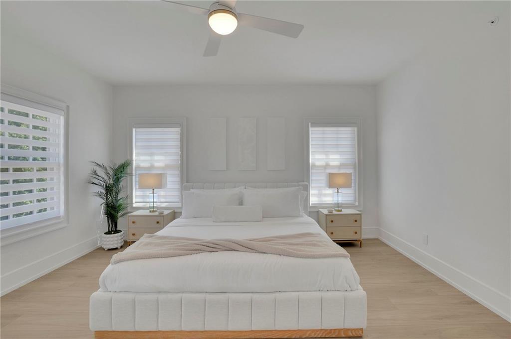 343 Sugarview Road Sugar Hill, GA 30518 - Photo 21 of 40 a spacious bedroom with a bed and window