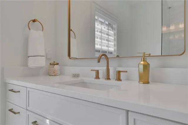 a bathroom with a sink and a mirror