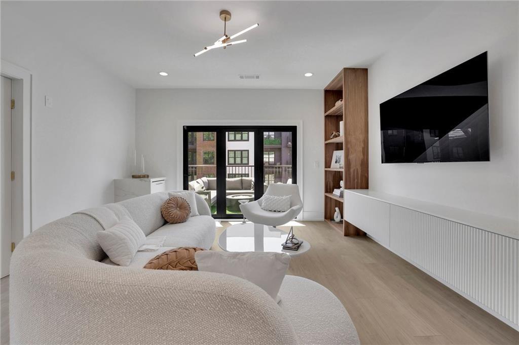 343 Sugarview Road Sugar Hill, GA 30518 - Photo 25 of 40 a living room with furniture and a flat screen tv
