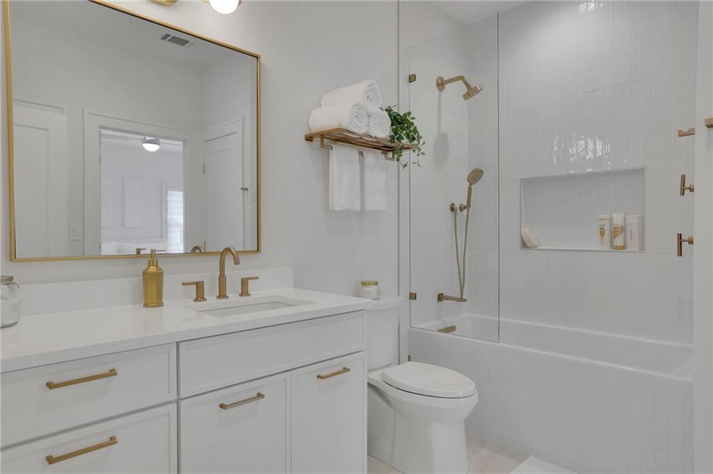 343 Sugarview Road Sugar Hill, GA 30518 - Photo 28 of 40 a bathroom with a sink a toilet and shower