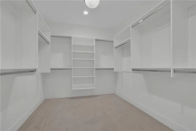 a view of an empty walk in closet