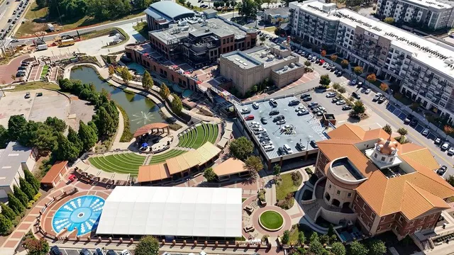 an aerial view of residential house with outdoor space and parking