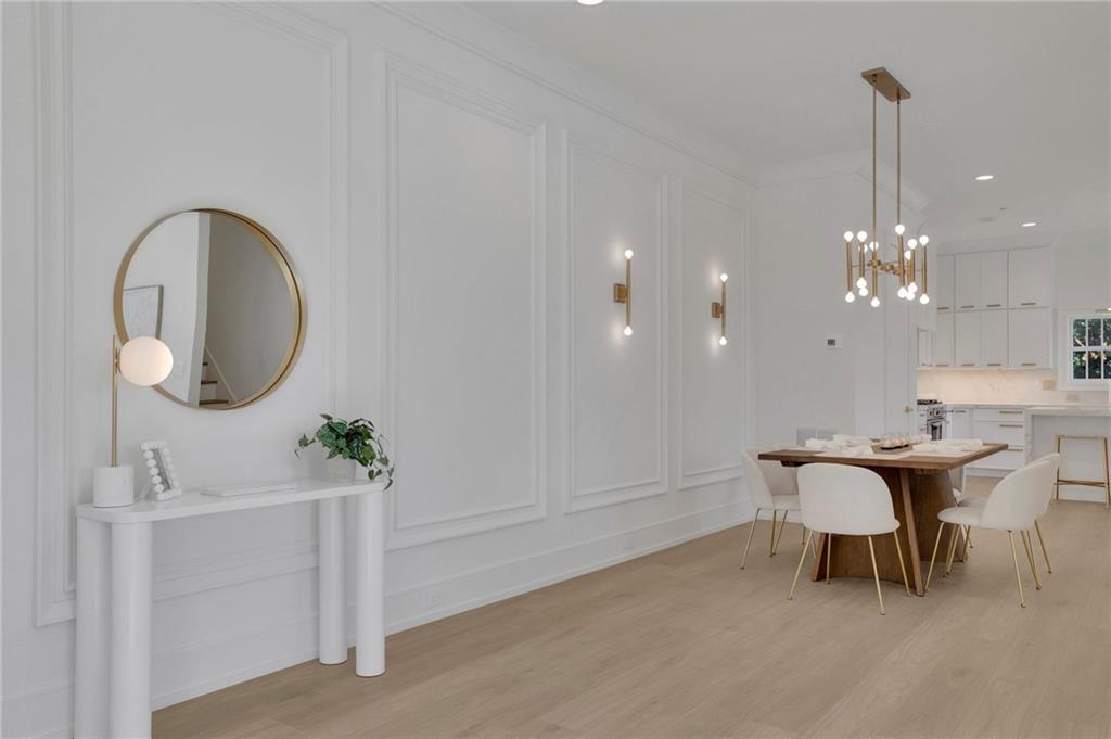 343 Sugarview Road Sugar Hill, GA 30518 - Photo 4 of 40 a dining room with furniture and a mirror