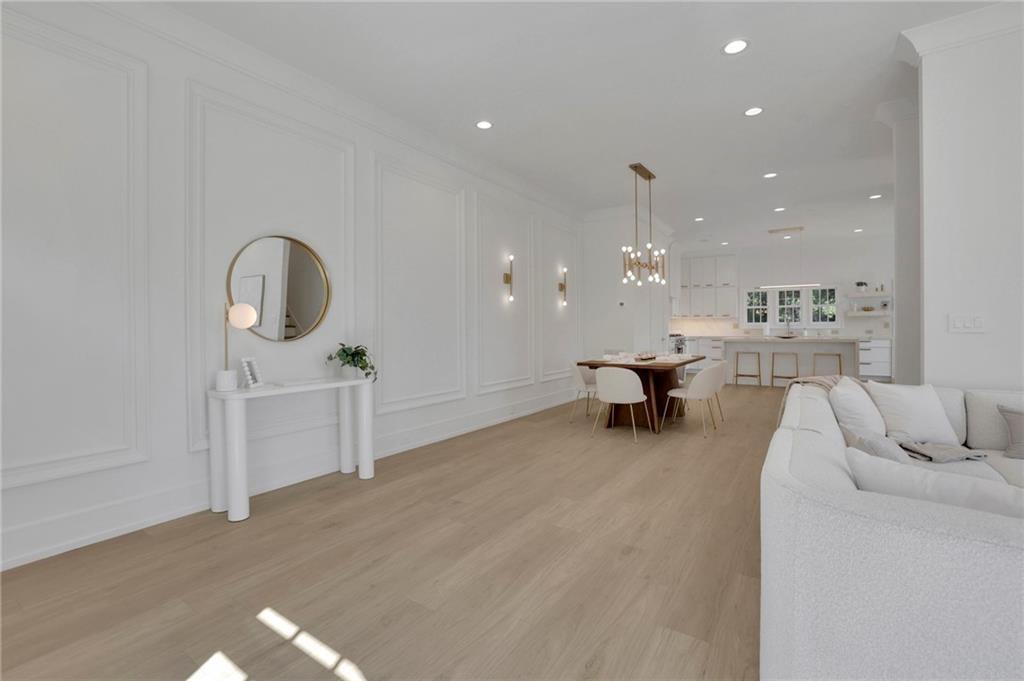 343 Sugarview Road Sugar Hill, GA 30518 - Photo 5 of 40 a living room with furniture and a chandelier