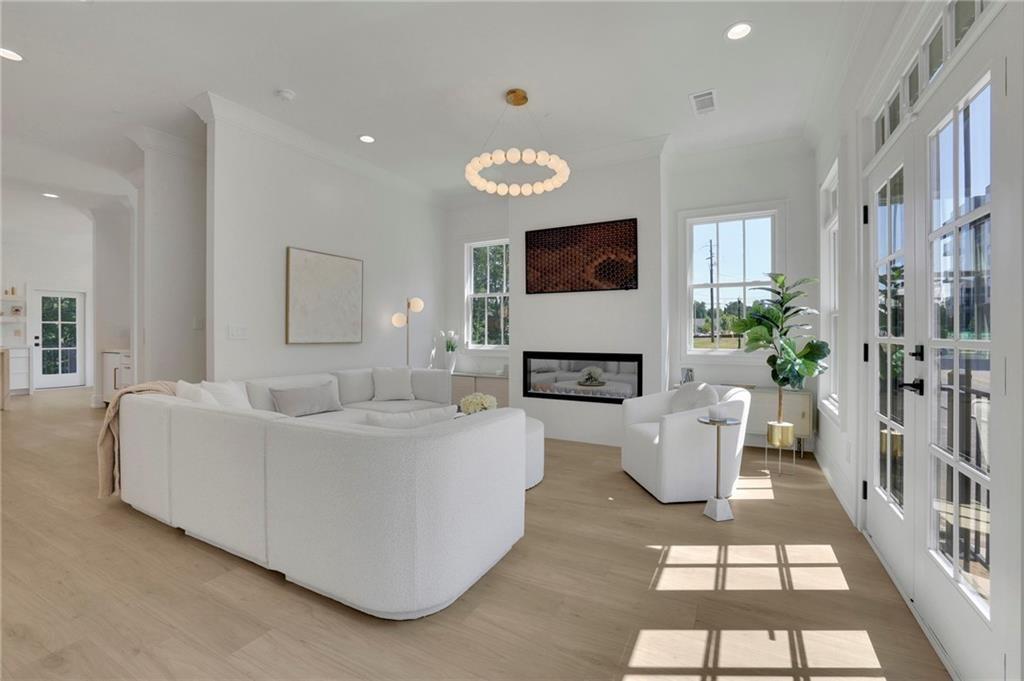 343 Sugarview Road Sugar Hill, GA 30518 - Photo 7 of 40 a living room with furniture and a flat screen tv