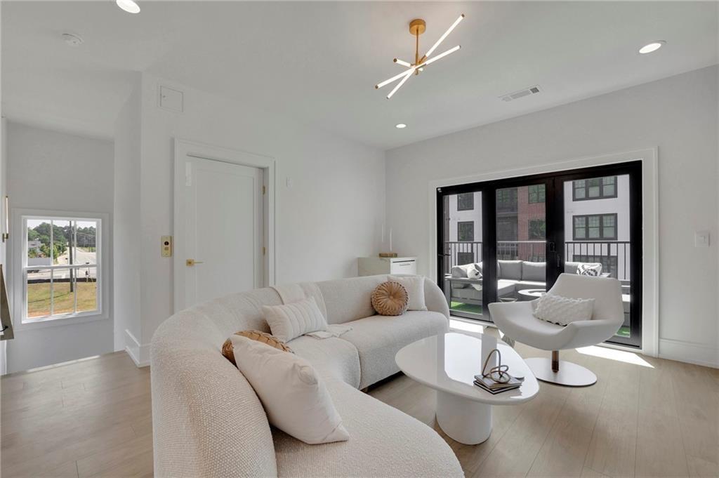 343 Sugarview Road Sugar Hill, GA 30518 - Photo 8 of 40 a living room with furniture and a window