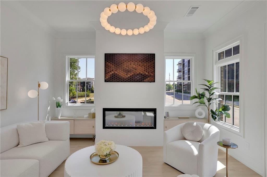 343 Sugarview Road Sugar Hill, GA 30518 - Photo 9 of 40 a living room with furniture and a flat screen tv