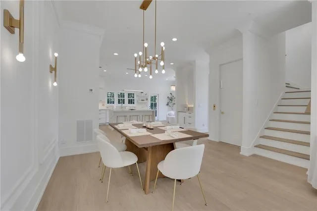 a dining room with furniture and wooden floor