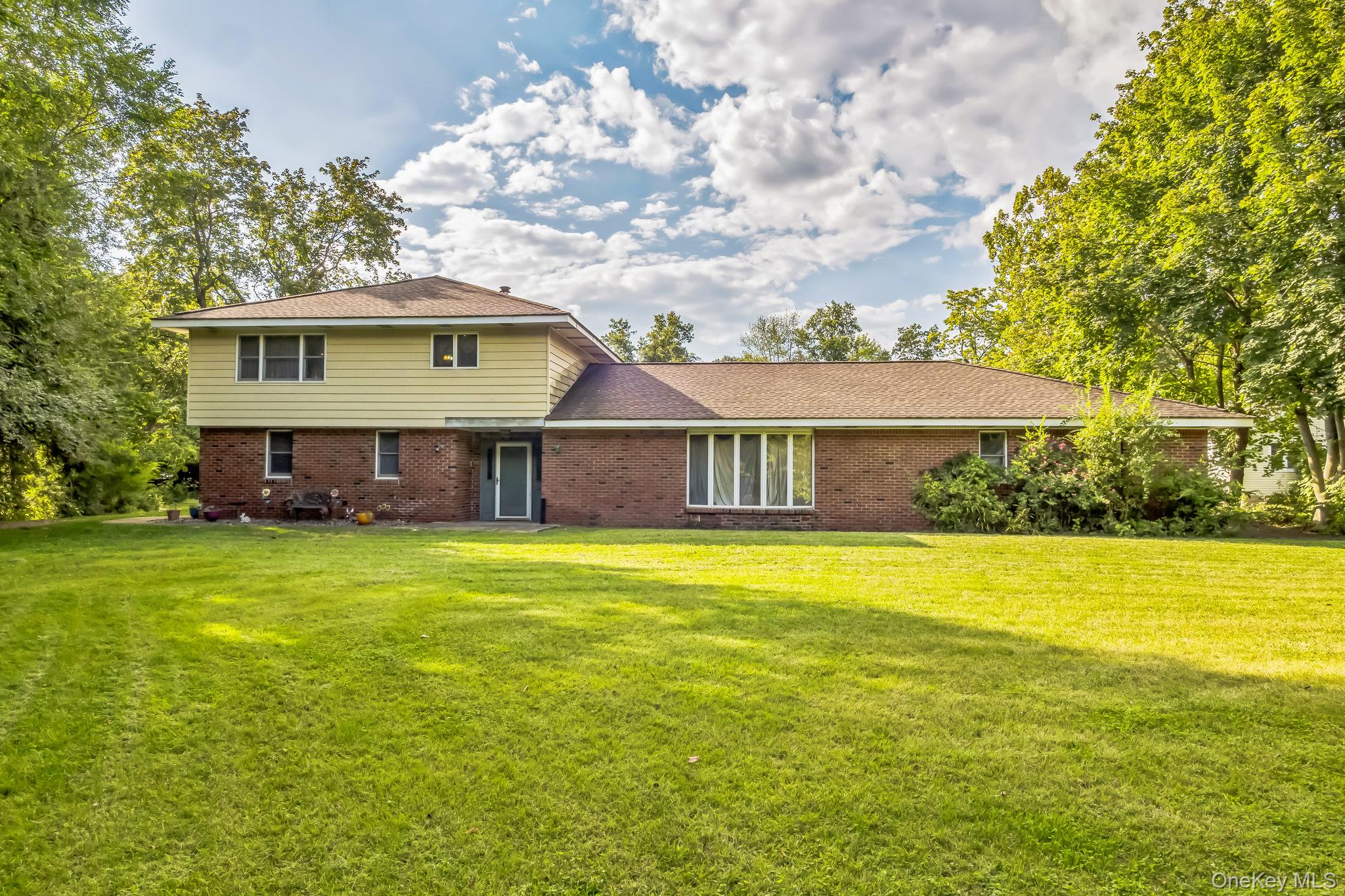 24 New Road Milton, NY 12547 - Photo 1 of 30 a front view of a house with a garden