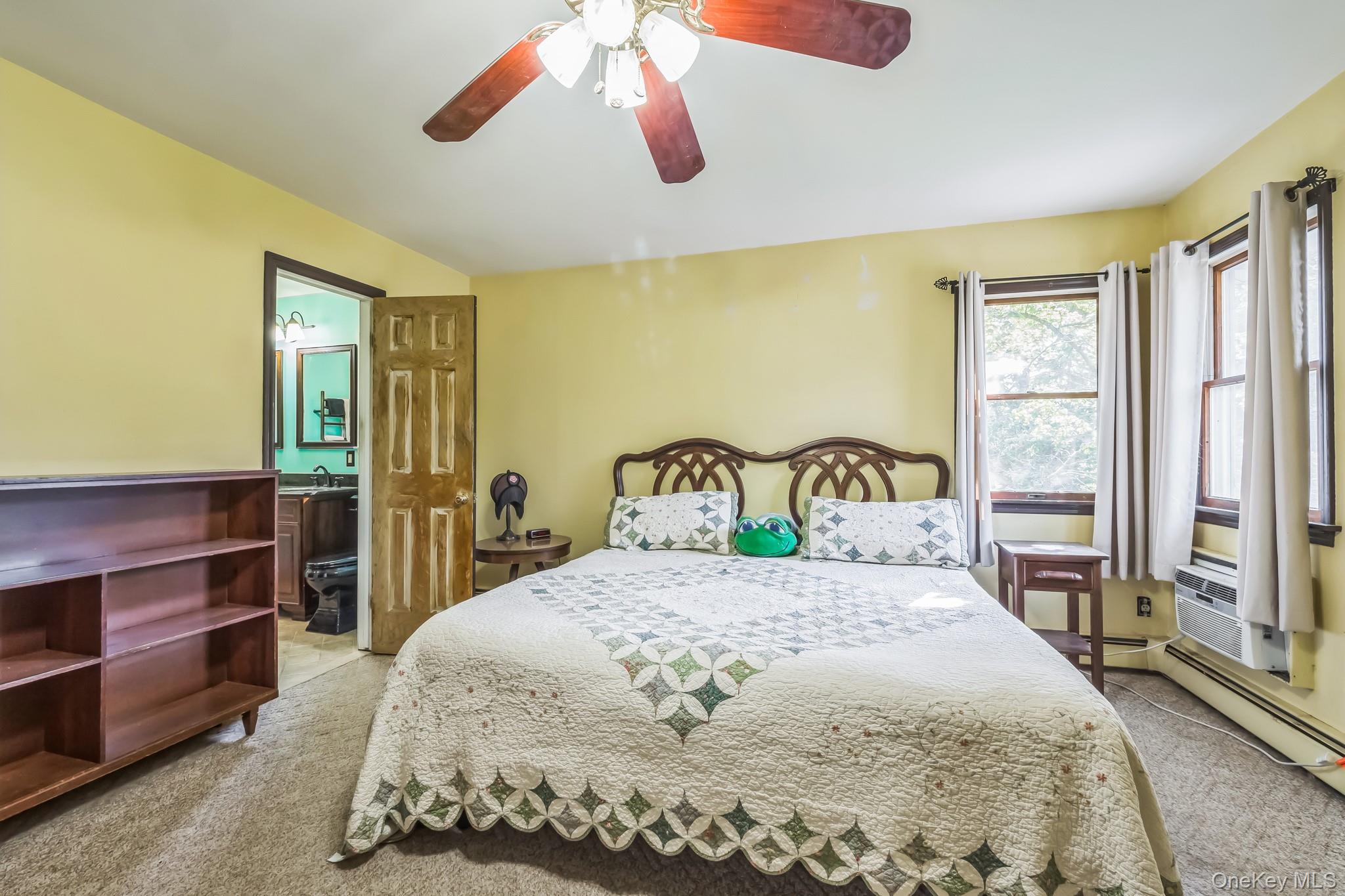 24 New Road Milton, NY 12547 - Photo 11 of 30 a bedroom with a large bed and a chandelier