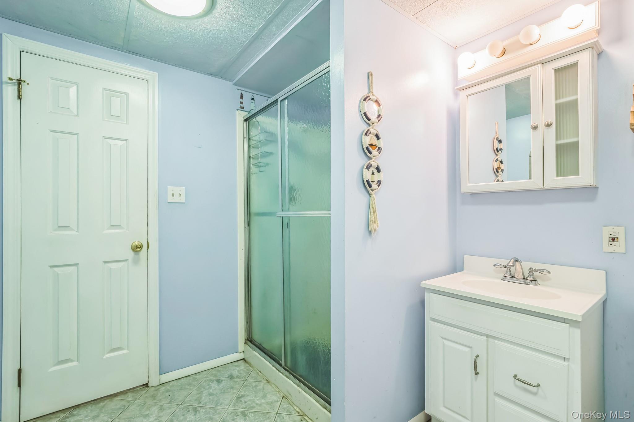 24 New Road Milton, NY 12547 - Photo 26 of 30 a bathroom with a sink and mirror