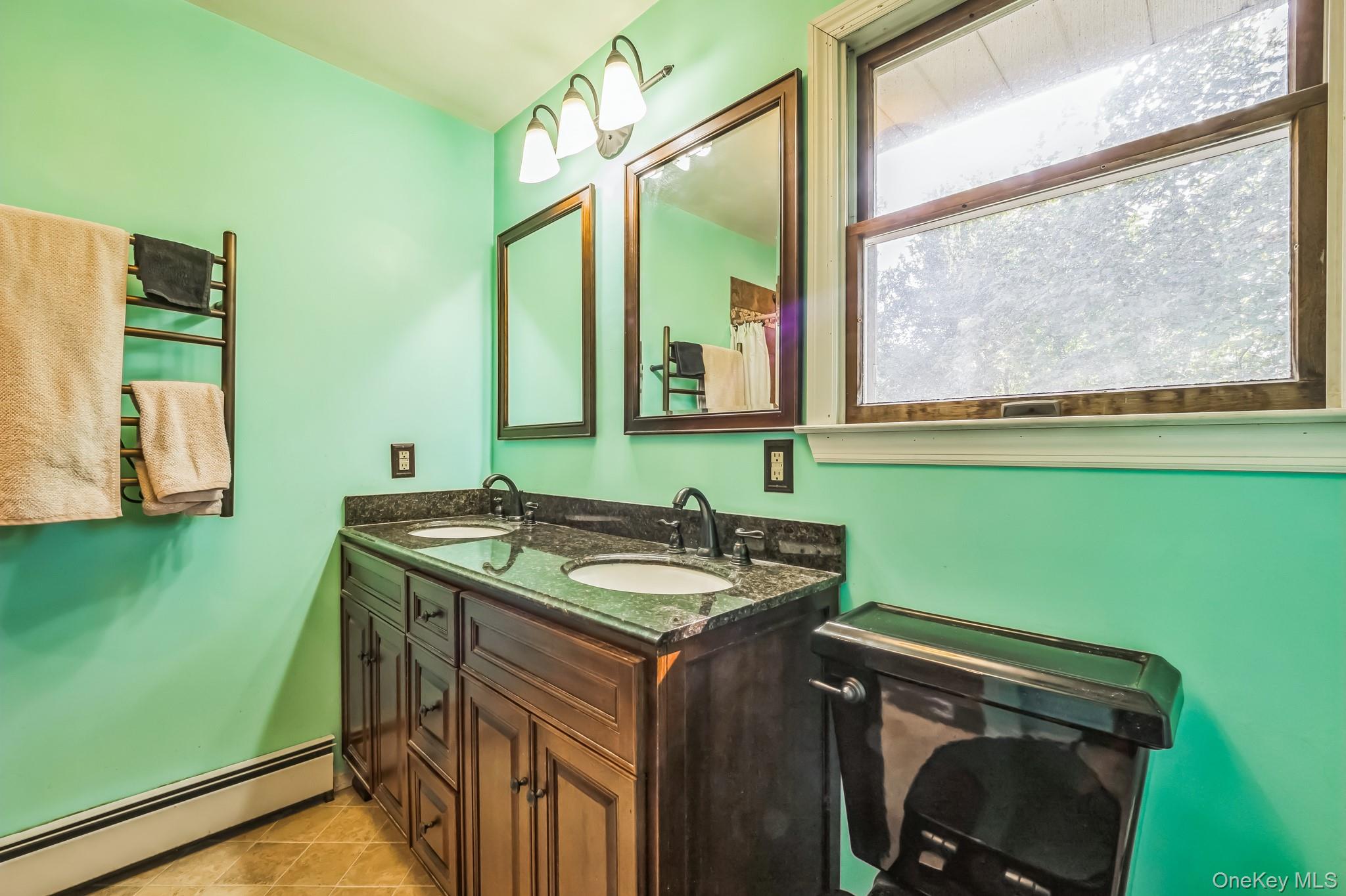 24 New Road Milton, NY 12547 - Photo 27 of 30 a bathroom with a granite countertop sink and a mirror