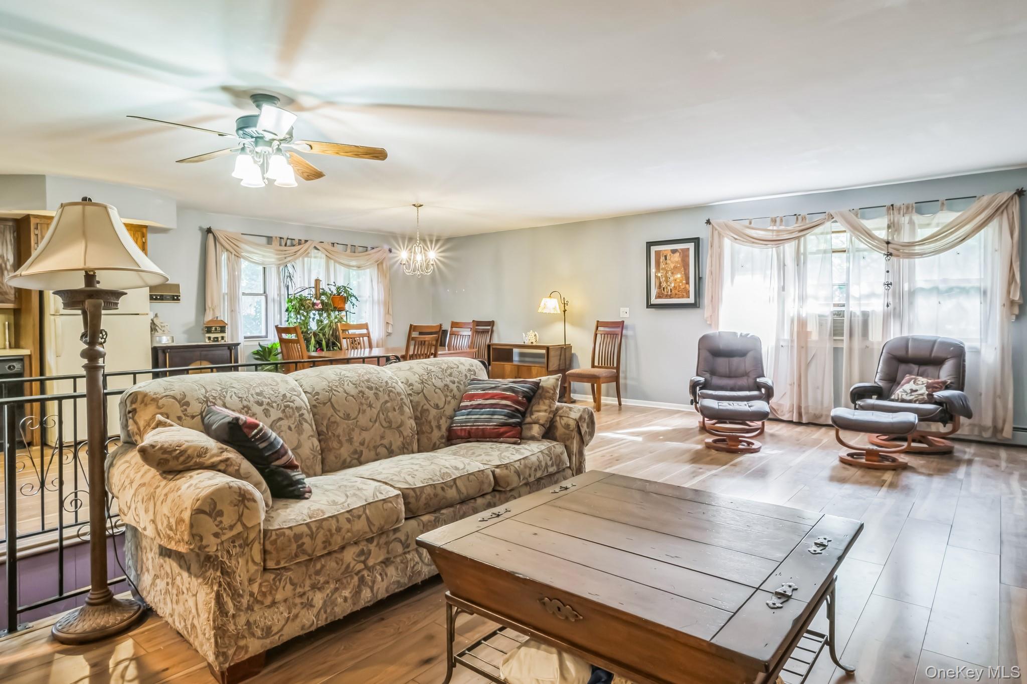 24 New Road Milton, NY 12547 - Photo 7 of 30 a living room with furniture a chandelier and a flat screen tv