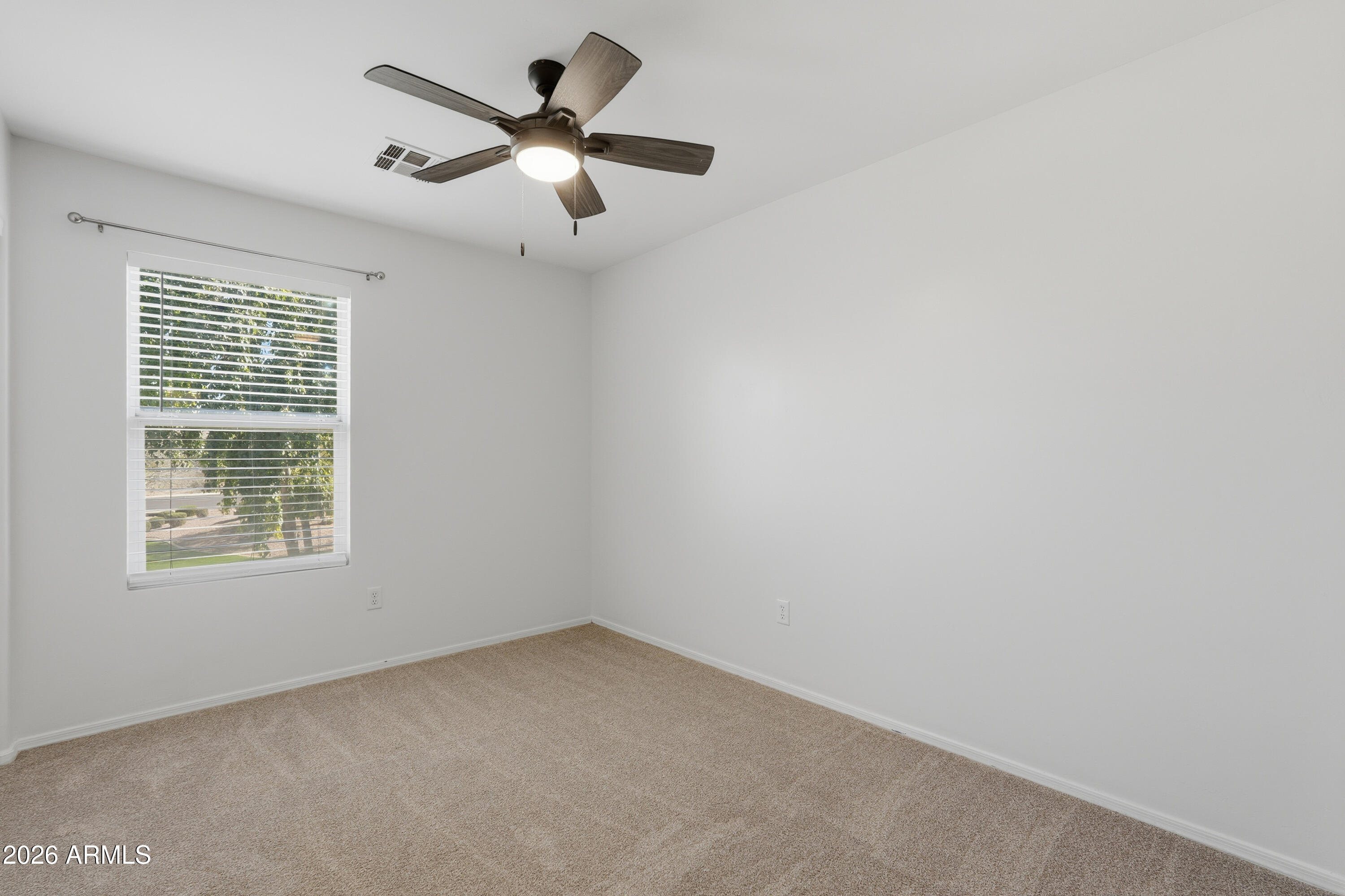 2497 East Ivanhoe Court Gilbert, AZ 85295 - Photo 23 of 57 an empty room with a window and a fan